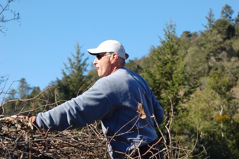 John Lococo.jpg - Its back to work for the afternoon, as John Lococo brings more limbs to chip, and larger pieces to be cut into firewood.